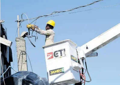  ?? FILE ?? A worker from the Jamaica Public Service Company Limited. The company is seeking contractor­s to help in managing its network.