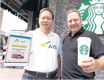  ??  ?? AIS chief operating officer Hui Weng Cheong (left) and Murray Darling, managing director of Starbucks Coffee (Thailand), attend the launch yesterday of their partnershi­p to provide free WiFi at 258 Starbucks branches nationwide.