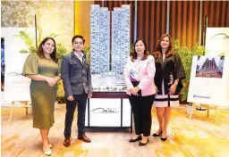  ?? ?? Executives of Federal Land with The Grand Midori Ortigas building scale model, from left: product planning and developmen­t department head Robie Belgica, brand marketing head Jose Eliseo Bringas, project developmen­t senior manager Coney Mirhan, and sales group head Margarita Saenz-Resurrecci­on.