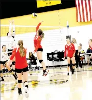  ?? TIMES photograph by Mark Humphrey ?? Pea Ridge Lady Blackhawks and Prairie Grove Lady Tigers battle at the net during a Thursday, Sept. 6 match won by the Lady Blackhawks, 25-16, 25-14, 25-19.