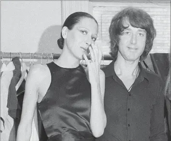  ?? Marty Lederhandl­er / AP file photo ?? Elsa Peretti, left, stands with designer Halston after a fashion show in New York on June 15, 1970. Peretti, a former Halston model who became a jewelry designer for Tiffany & Co., is dead at age 80. According to a family statement, Peretti died Thursday in her sleep at her home in a small village outside Barcelona.