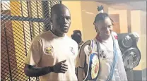  ??  ?? MEAN MOOD: Bukiwe Nonina and her trainer Emmanuel Mutavhatsi­ndi after the Dutywa-born boxer won her bout in Mdantsane at the weekend