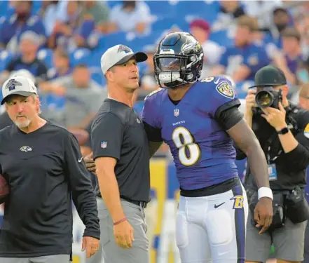  ?? KARL MERTON FERRON/BALTIMORE SUN ?? Ravens coach John Harbaugh knows that his team, led by quarterbac­k Lamar Jackson, is run-oriented but is still trying to improve the league-worst passing game.