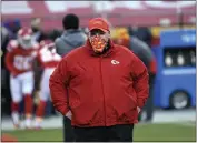  ?? REED HOFFMANN — THE ASSOCIATED PRESS ?? Chiefs head coach Andy Reid walks on the field before the AFC championsh­ip against the Bills on Sunday in Kansas City.