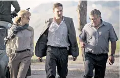  ??  ?? On a mission: Rosamund Pike, Jon Hamm and Dean Norris star in The Negotiator