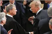  ?? AP 2017 ?? President Donald Trump, with Chief Justice John Roberts before a speech to a joint session of Congress on Feb. 28, 2017, responded Wednesday to Roberts that “you do indeed have ‘Obama judges.’ ”