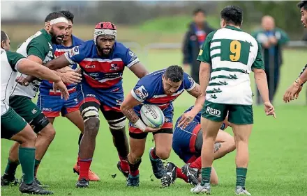  ?? RICHARD SPRANGER ?? Whaiiora Rangiwai makes a run towards Jesse Pascoe during the Counties Manukau Premier Club Rugby game between Ardmore Marist and Manurewa. Ardmore Marist won the game 20-3.