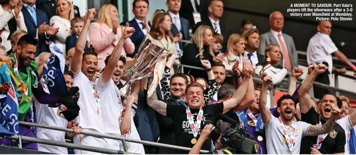  ?? Picture: Pete Stonier ?? A MOMENT TO SAVOUR: Port Vale’s players lift the silverware after a 3-0 victory over Mansfield at Wembley.