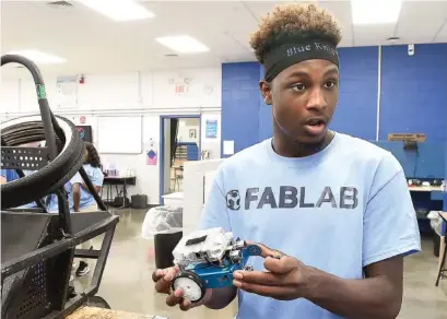  ?? STAFF PHOTO BY ROBIN RUDD ?? Dalewood Middle School student Walter Rice explains the developmen­t of different vehicles in the school’s Fab Lab in 2019.