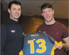  ??  ?? Ray McCabe presents Joe Mulholland (Ardee CS) with his jersey.