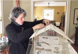  ?? John Bright / Contribute­d photo ?? Artist Susan Tabachnick works on a piece in her Bridgeport home. Above, This shadowbox design features watch springs and resistors by artist Susan Tabachnick.