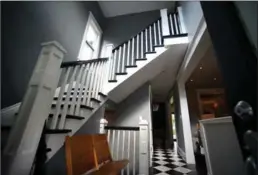  ??  ?? Initially the entrance was dark and cramped, but after Connolly removed a low ceiling, opened up the stairway and added a window above the door, light suddenly spilled deep into the interior. Black and white tile, laid on the diagonal, gives the...