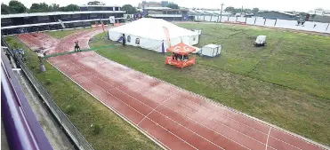  ?? RICARDO MAKYN/MULTIMEDIA PHOTO EDITOR ?? The Byron Bachelor Athletics Complex with its new synthetic track, which was opened at the Melbourne Park campus of Kingston College yesterday.