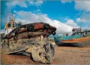  ?? THANASSIS STAVRAKIS/AP ?? Small boats recovered after spending years as shipwrecks are shown at a dock in Elefsina, Greece. Greek authoritie­s have begun to remove sunken ships, a danger to shipping.