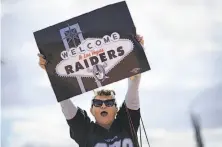  ?? John Locher / Associated Press ?? Geraldine Lacy celebrates the NFL’s approval of the Raiders’ move to Las Vegas, where the team would begin play in 2020.