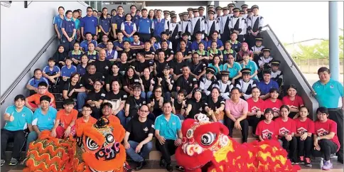  ??  ?? Alumni of SMK St Athony pose with students and teachers at the entrance of the school’s main hall.