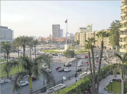  ??  ?? Rebel music: Tahrir Square in Cairo (above) served as a platform for new musical acts during the 2011 revolution. A mahraganat performanc­e in a city street (left). Young men (below) perform at at a street wedding with mahraganat music.