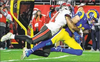  ?? Robert Gauthier Los Angeles Times ?? COOPER KUPP’S catch led to the winning field goal in the Rams’ 30-27 playoff victory at Tampa Bay.