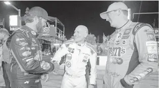  ?? PHELAN M. EBENHACK / AP ?? Martin Truex Jr., from left, Jacques Villeneuve and Kyle Busch greet each other Thursday before the second of two NASCAR Daytona 500 qualifying auto races at Daytona Internatio­nal Speedway.