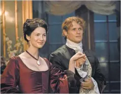  ??  ?? Claire ( Caitriona Balfe) and Jamie ( Sam Heughan) are the toast of Paris in Outlander on Starz. The third season premieres in September.