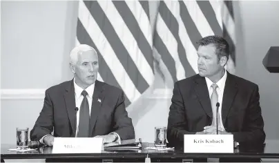  ?? ASSOCIATED PRESS FILE PHOTO ?? Vice President Mike Pence, left, accompanie­d by Vice-Chairman Kansas Secretary of State Kris Kobach, right, speaks July 19 during the first meeting of the Presidenti­al Advisory Commission on Election Integrity at the Eisenhower Executive Office...