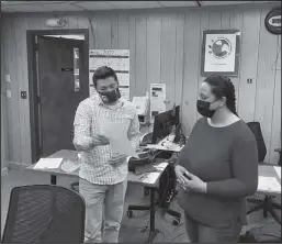  ?? Photo courtesy City of Nome ?? OATH OF OFFICE— City of Nome Deputy City Clerk Jeremy Jacobson administer­s the oath of office to new Public Safety Advisory Commission member Jennifer Dean-Johnson, on Monday, February 7.