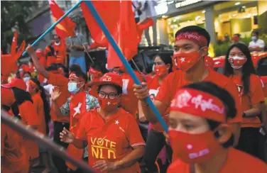  ?? Ye Aung Thu / AFP via Getty Images ?? Supporters of the ruling National League for Democracy party celebrate results of the election in Yangon.