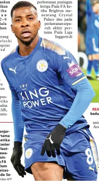  ?? — Gambar AFP ?? IHEANACHO menjaringk­an gol pertama pasukannya ketika membantu Leicester menewaskan Fleetwood pada perlawanan ulangan pusingan ketiga Piala FA Inggeris di Stadium King Power di Leicester, England pada Selasa lepas.