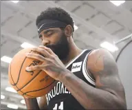  ?? Emilee Chinn / Getty Images ?? AllStar Kyrie Irving signed with the Nets in the offseason.
