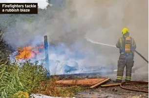  ?? ?? Firefighte­rs tackle a rubbish blaze