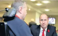  ??  ?? Prince William talks to members of the Welsh Rugby Charitable Trust before the game