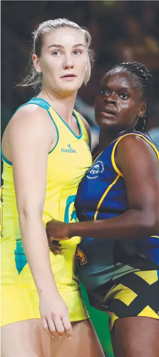  ??  ?? Courtney Bruce lining up against Shonica Wharton of Barbados during the Commonweal­th Games.