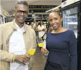  ?? ?? Jamaica Observer Table Talk Food Awards judges Adolph Raynor and Stacy Belnavis accessoris­ed their chipper Monday evening convo with flutes of Prosecco & Popsicles.