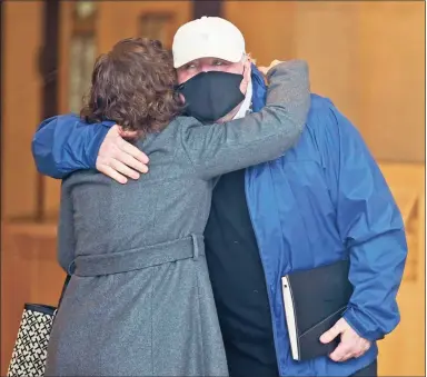  ?? Seth Wenig / Associated Press ?? Michael Skakel hugs someone as he arrives to a courthouse in Stamford Friday.