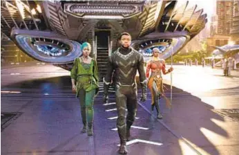  ?? Film Frame / Marvel Studios ?? LUPITA NYONG’O, left, Chadwick Boseman and Danai Gurira star in a superhero movie that puts black women and men at the center of the story.