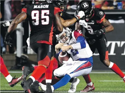  ?? JUSTIN TANG/THE CANADIAN PRESS ?? Alouettes quarterbac­k Johnny Manziel is hit hard after scampering to the goal-line during Saturday’s game in Ottawa. Manziel wasn’t at practice Tuesday, but did attend meetings. Head coach Mike Sherman said Manziel isn’t feeling any effects from the hit.