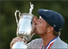  ?? GREGORY SHAMUS/ GETTY IMAGES ?? Bryson DeChambeau of the United States kisses the championsh­ip trophy in celebratio­n after winning the 120th U.S. Open Championsh­ip on Sunday in Mamaroneck, NY.