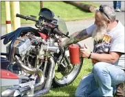  ??  ?? Bill Lowery of Bechtelsvi­lle and his 1979Top Fuel Harley at Saturday’s event.