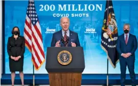  ?? AP PHOTO/EVAN VUCCI ?? Vice President Kamala Harris, left, and White House COVID-19 Response Coordinato­r Jeff Zients, right, listen as President Joe Biden speaks about COVID-19 vaccinatio­ns at the White House on Wednesday