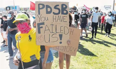  ?? RICHARD LAUTENS TORONTO STAR ?? A student-led march against racism Wednesday culminated outside a meeting of the Peel District School Board, where, inside, trustees voted to have the province step in and take control of the troubled board.