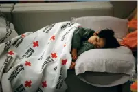  ?? Associated Press ?? left
Malachia Medrano sleeps at a Red Cross shelter after Hurricane Harvey hit Houston.