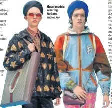  ?? PHOTOS: AFP ?? Gucci models wearing turbans