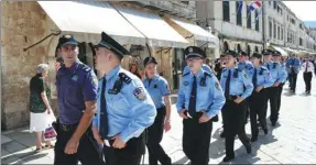  ?? GAO LEI / XINHUA ?? Chinese and Croatian police officers conduct a joint patrol in the old town of Dubrovnik, Croatia, on Sunday. Croatia follows Italy as the second country to cooperate and exchange officers with Chinese police to provide assistance to tourists.