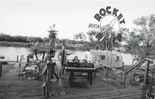  ??  ?? Campers, many of them SpaceX enthusiast­s, hang out on the deck at Rocket Ranch before dinner. Guests there can book a seat on the ranch’s pontoon boat to watch SpaceX launches.