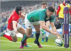  ??  ?? Jacob Stockdale of Ireland dives in for a first-half try