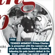  ?? ?? 1988 TENDER MOMENT: Prince Charles is presented with the runners-up prize by his mother, Queen Elizabeth, following his polo team’s defeat in the Silver Jubilee Cup match against France at Windsor Great Park.