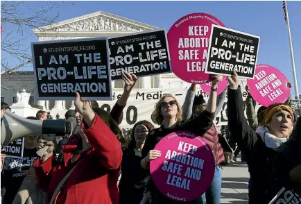  ?? AP ?? Protesters on both sides of the abortion issue gather outside the Supreme Court in Washington, DC during the March for Life yesterday.
