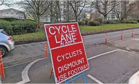  ?? ?? The pop-up cycle lane, and right, cycling commission­er Adam Tranter