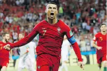  ?? FRANCISCO SECO/AP ?? Portugal’s Cristiano Ronaldo celebrates his first goal during the Group B match between Portugal and Spain at the World Cup in Sochi, Russia on Friday, before going on to score two more times.