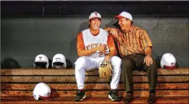  ?? CONTRIBUTE­D 2004 ?? Huston Street and his father, James Street, pose for a portrait at Disch-Falk Field in 2004. James Street, a former quarterbac­k, led Texas to a national championsh­ip.